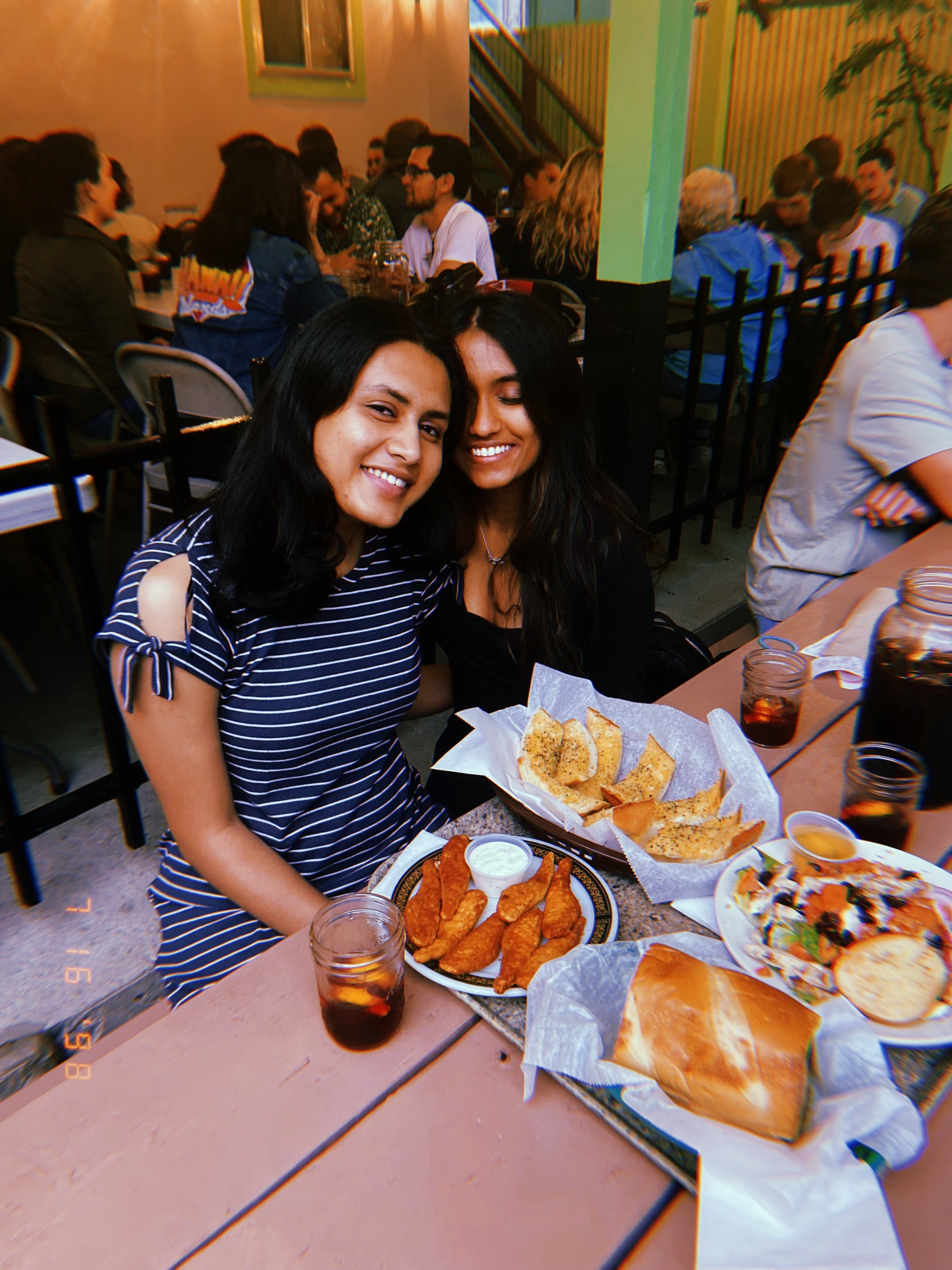 A friend and I with a spread in front of us at Casa Dominick's, a family-owned Italian bar/restaurant in Ann Arbor. We ordered the spicy chicken fingers, fresh garlic bread, a chicken Cobb salad and a chicken sub.