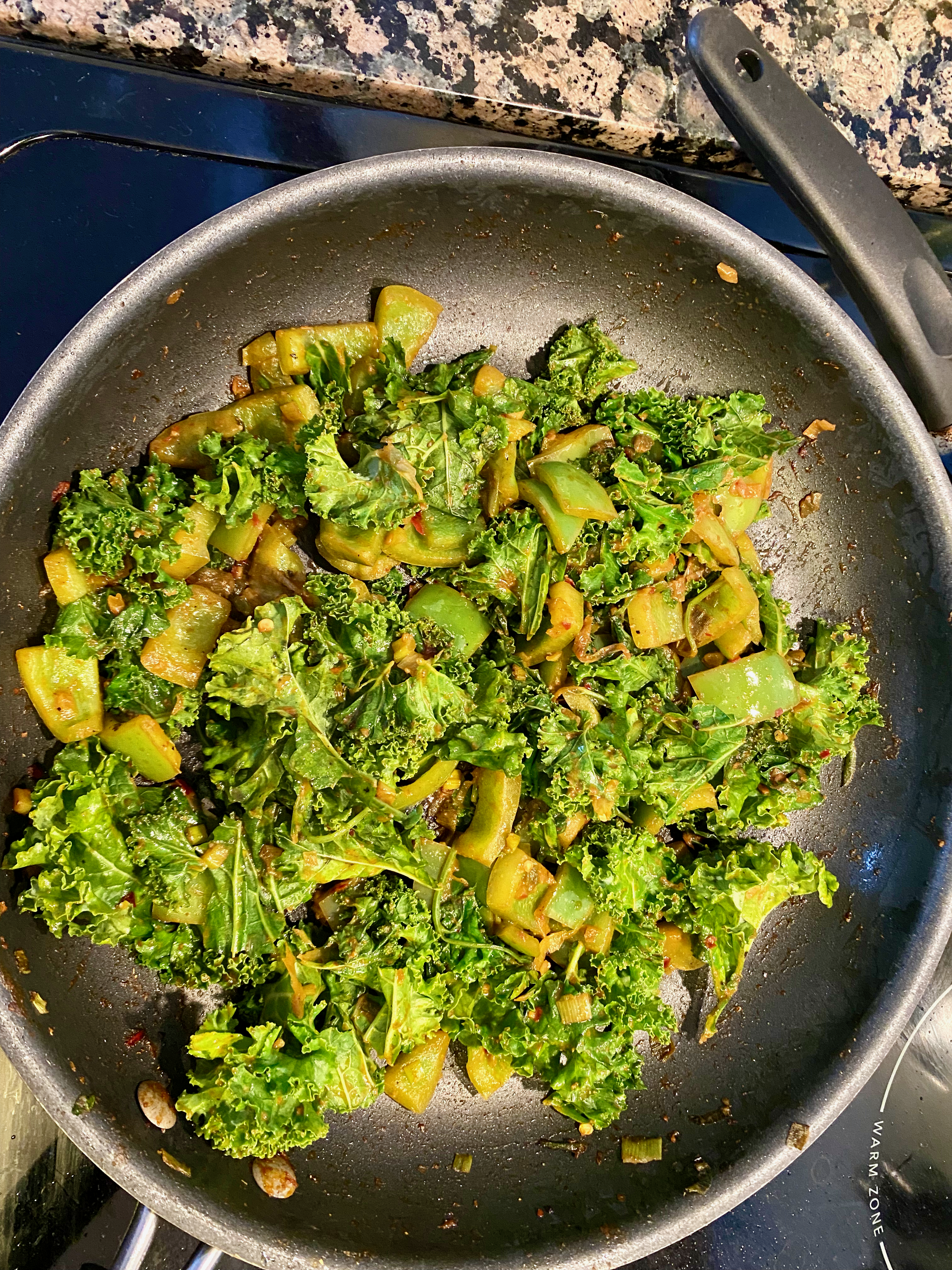 A hearty green salad consisting mainly of lightly sauteed kale and green peppers.